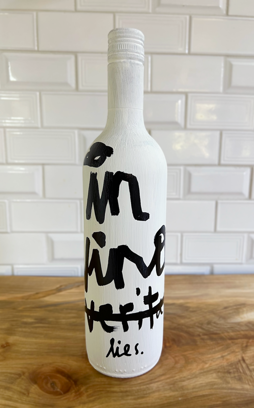 Lies Bottle — front