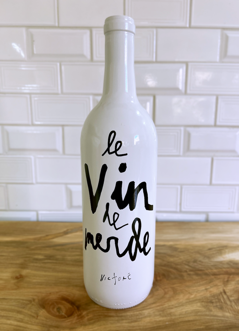 Merde Bottle — front
